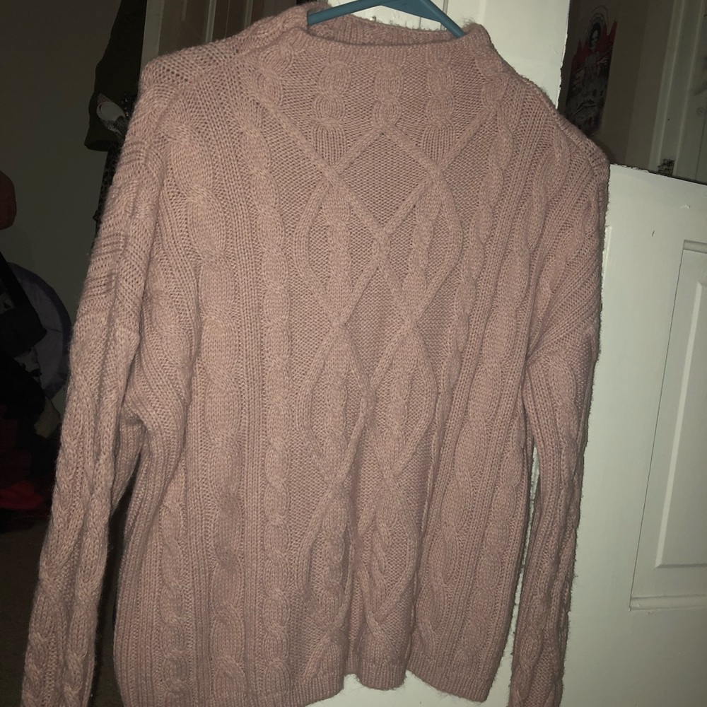 Pink cable-knit sweater